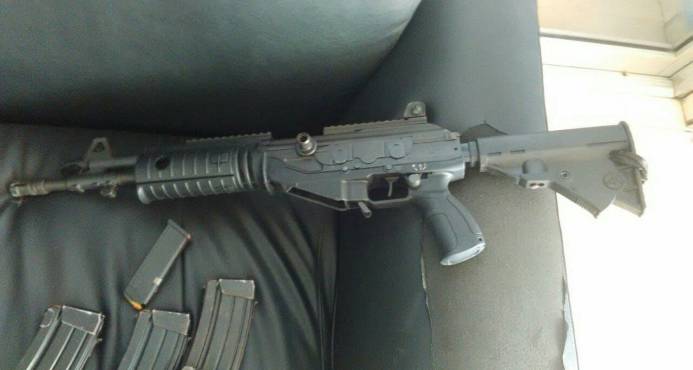 INFORMAN FUSIL USADO PARA ASALTO A SUCURSAL BANCARIA ES  DE LA POLICIA HAITIANA